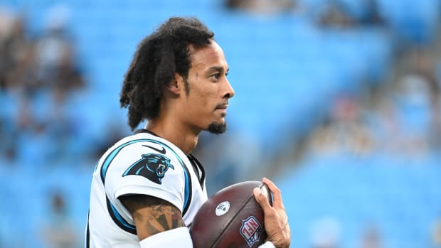 Carolina Panthers WR Robby Anderson holds football